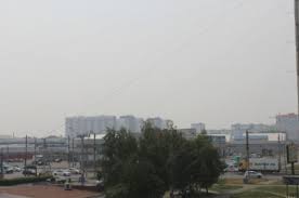 Дымка и гарь снова заволокли Новосибирск